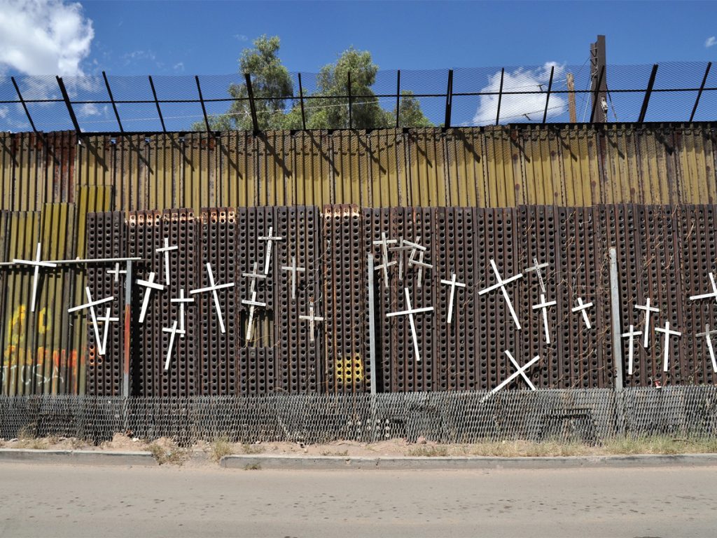 White crosses with the names of those who have died crossing the US border adorn the Mexican side of the wall in Heroica Nogales, Mexico.